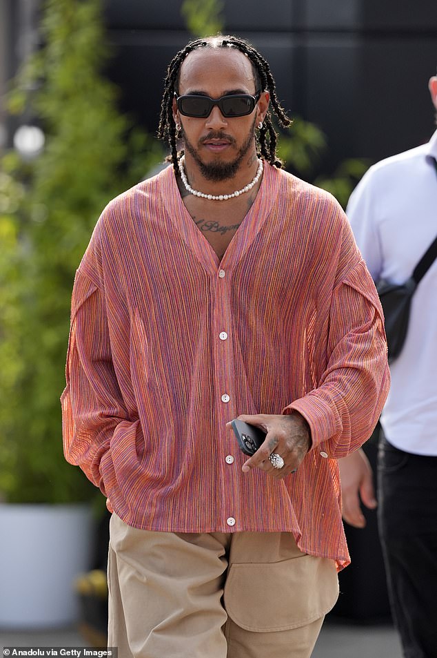 Lewis cut a casual figure in a colourful shirt in his latest quirky fashion statement at the Italian Grand Prix last month