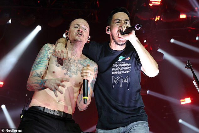 'While publicly discussing his general problems with life during the One More Light press tour, he privately told his loved ones about a specific problem: the urge to drink had once again occupied his thoughts. (Chester pictured with Mike Shinoda on July 3, 2017 - 17 days before his death)