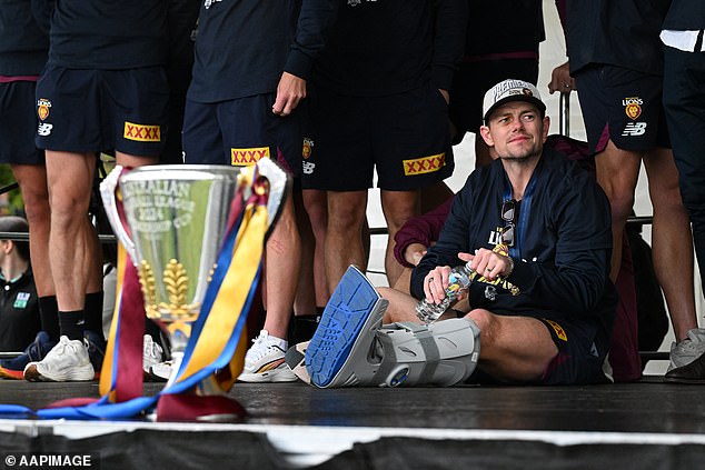 Lachie Neale turned up to the Lions' Melbourne family day at Brunswick St Oval in Fitzroy on Sunday with his left leg in a moon boot