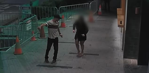 CCTV footage shows a man and woman getting into an altercation on Macquarie Street in Liverpool just before a Good Samaritan intervenes