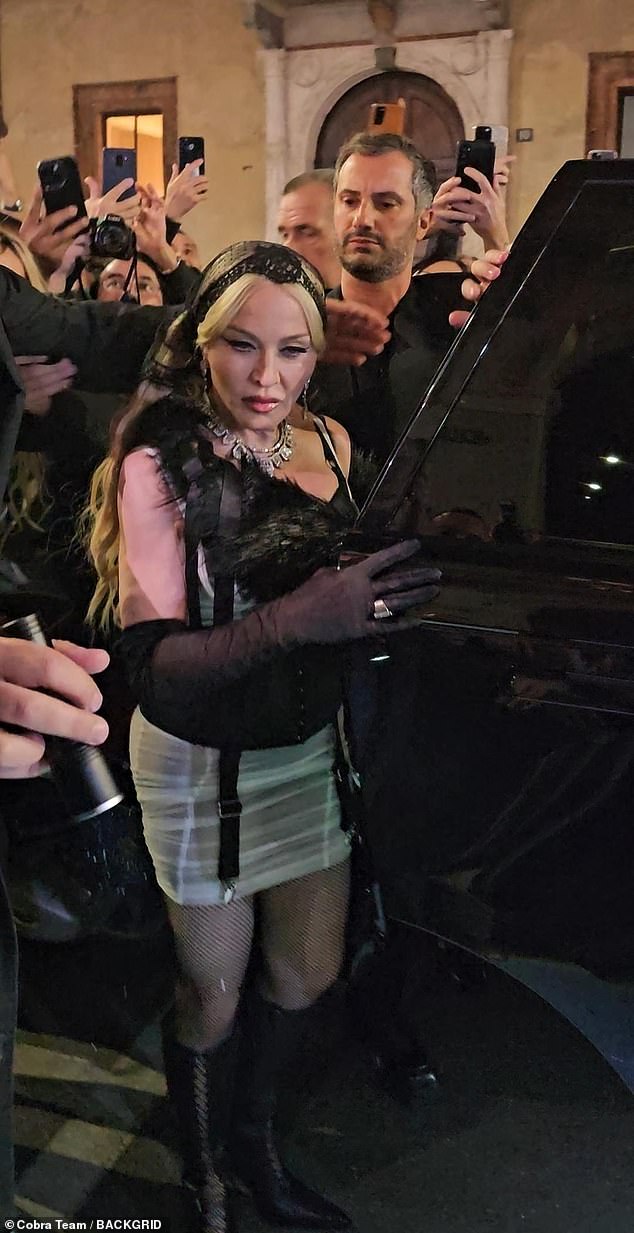 Madonna stunned with her flawlessly smooth complexion as she arrived at the Dolce & Gabbana afterparty in Milan on Saturday