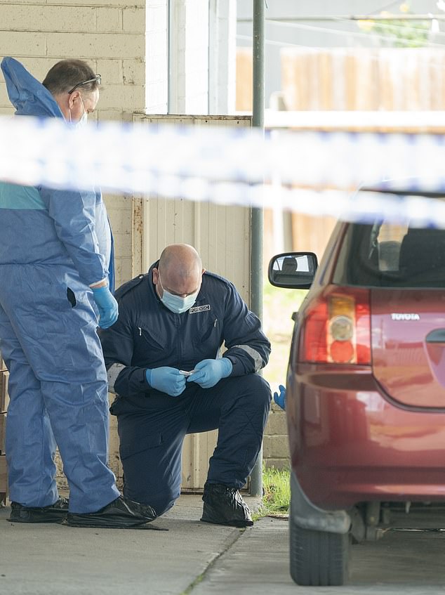 A young mother accused of leaving her unconscious newborn baby in the driveway of a home has been charged with child abuse by detectives (pictured, forensic examination of the home)