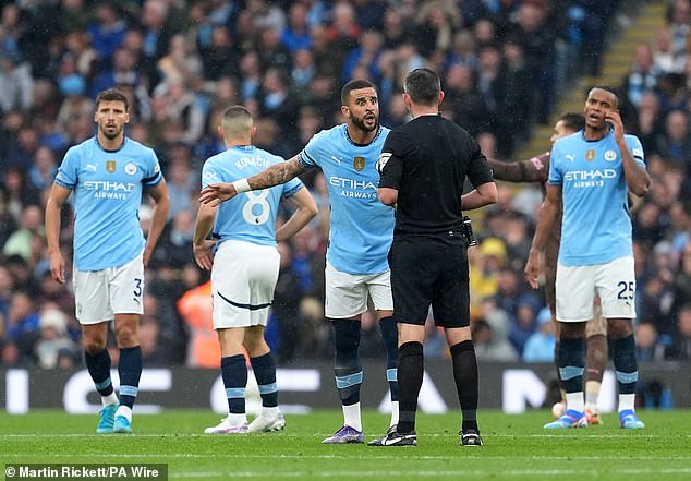 Kyle Walker (third from right) and his Manchester City team-mates were furious after Arsenal equalised in Sunday's big Premier League match