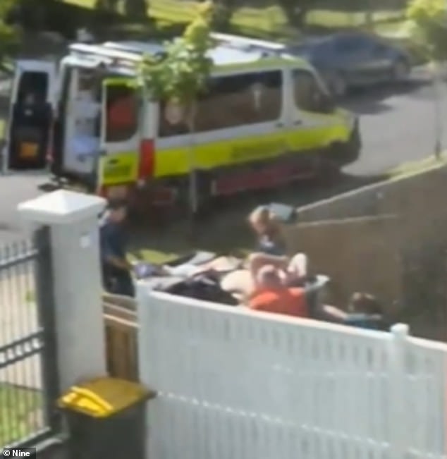 The shooting victim was carried into an ambulance before being taken to hospital