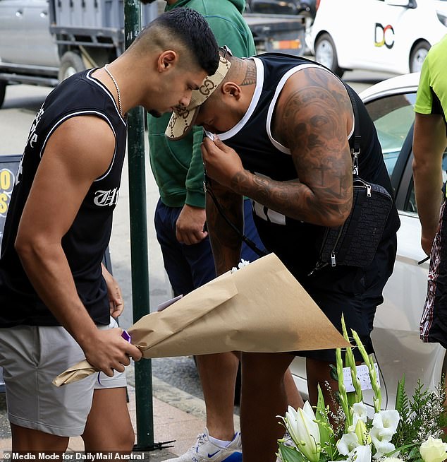 Relatives consoled each other outside the restaurant on Tuesday morning (photo) as distraught friends and family came to terms with the death of Mr Filihiahekava