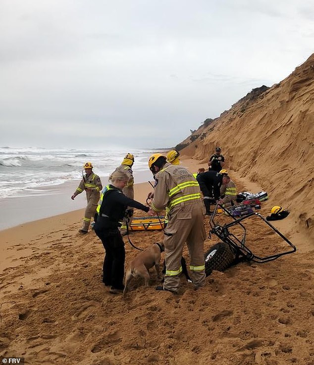 A man has been left with two broken legs after a morning walk with his dogs ended in a descent down a steep sand dune (photo, emergency services on scene)