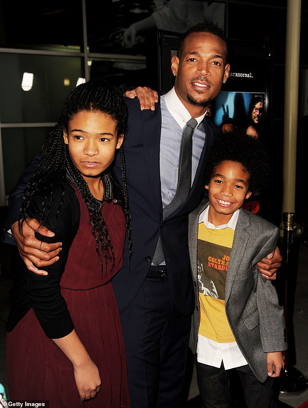 The 52-year-old Scary Movie star first revealed his eldest child was transgender in November, saying, 'I have a daughter who turned into a son' - Kai, Marlon and Shawn pose at the premiere of A Haunted House at the Arclight Theatre on January 3, 2013