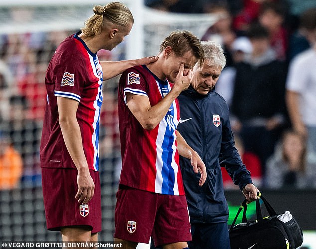 Erling Haaland was one of the players who consoled Odegaard, who looked in tears