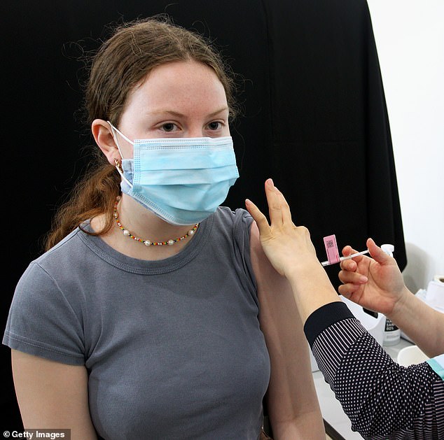 'Moderate to high risk' Australians aged 18 to 64 with underlying health conditions can now get the shingles vaccine for free (stock photo of a young woman being vaccinated)