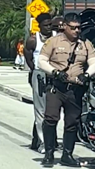 Tyreek Hill in handcuffs after being arrested by police