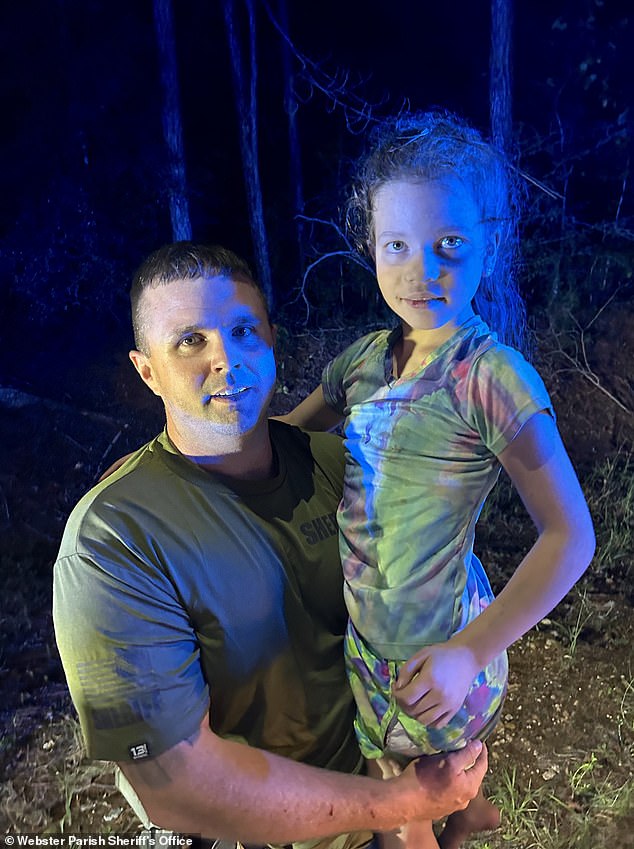 Police woke Peyton Saintignan (pictured), 10, from her sleep on the forest floor and carried her to safety