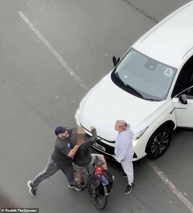 This was the shocking moment the male driver used both hands to strangle the cyclist