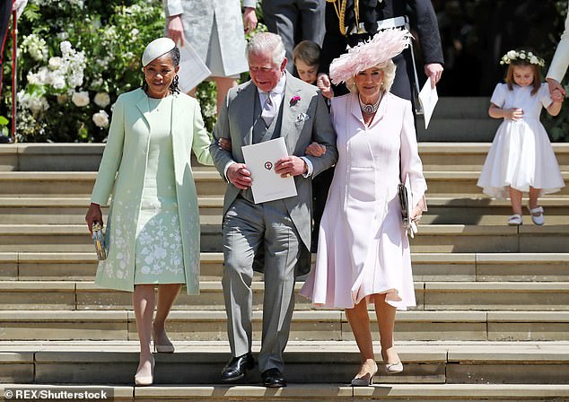 Doria joins hands with King Charles at her daughter's wedding in May 2018