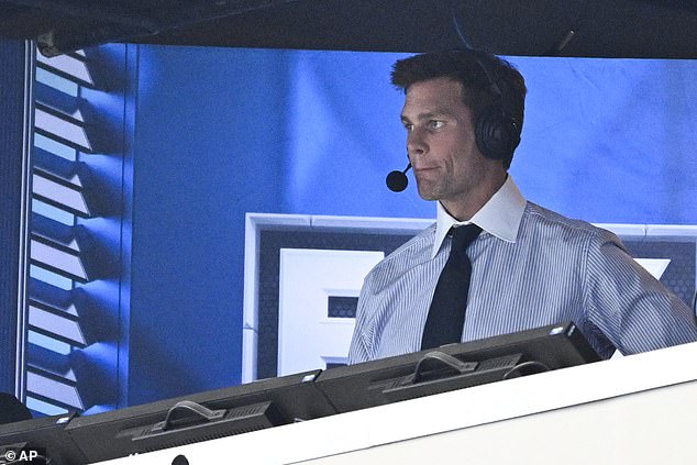 Former QB Tom Brady watches from the broadcast booth during the second half in Dallas