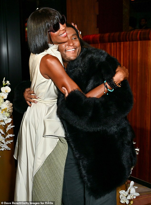 Naomi, 54, appeared to be in good spirits at the star-studded launch event as she hugged Law, 46