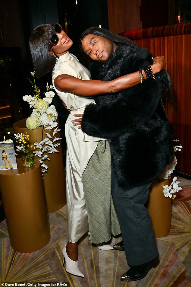 Naomi Campbell looked stylish in a long white satin blouse as she supported her friend Law Roach at the launch of his book in London on Monday night