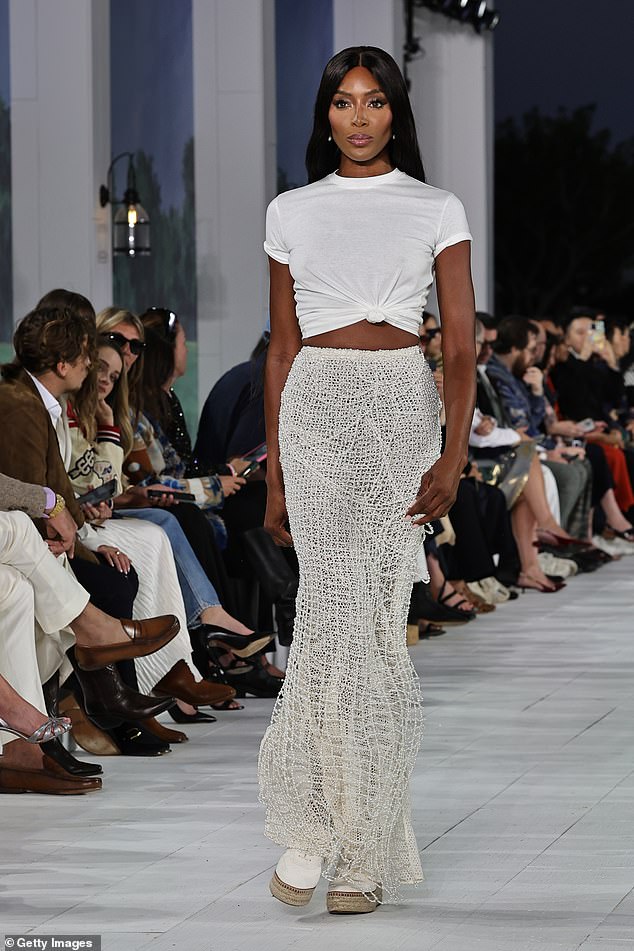 Naomi Campbell showed off her toned abs in a beaded skirt at the star-studded Ralph Lauren show in Bridgehampton, New York on Thursday