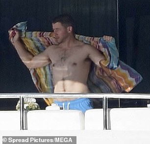 Nick Jonas took off his shirt and showed off his muscles as he soaked up the sun with wife Priyanka Chopra in Saint Tropez