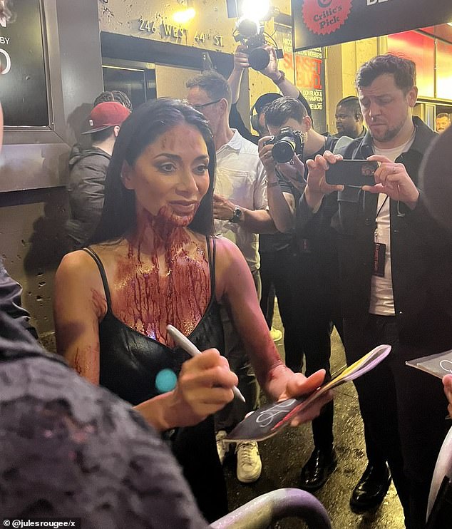 Nicole Scherzinger signed autographs while covered in fake blood after making her Broadway debut Sunday in the highly anticipated revival of Sunset Boulevard