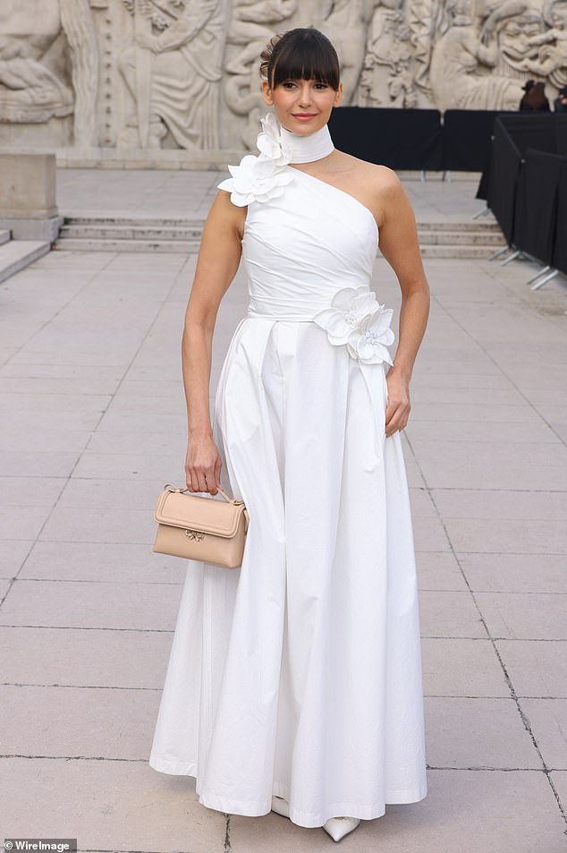 Nina Dobrev turned heads as she rocked the red carpet at Elie Saab's fashion show during Paris Fashion Week on Saturday