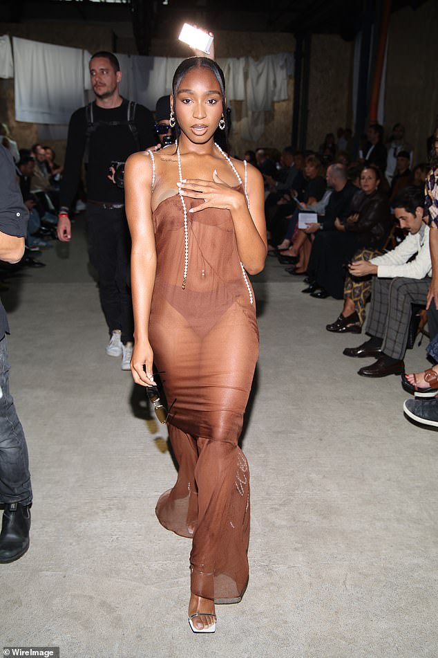 Normani made a bold statement in a sheer chocolate-colored dress on Thursday as she attended Moschino's Spring/Summer 2025 womenswear show during Milan Fashion Week