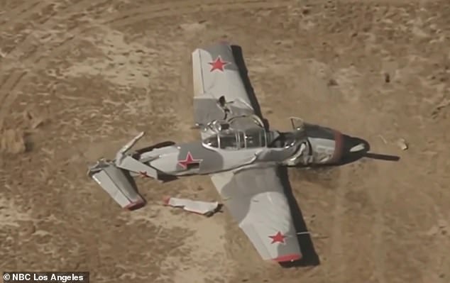 One pilot is dead and another escaped unharmed after two vintage planes collided in midair near Lancaster, California, Sunday afternoon. One of the crashed planes is pictured