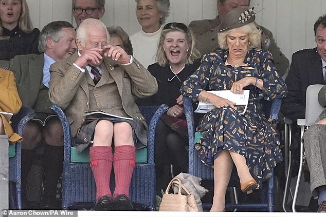 King Charles III bursts into laughter as he enjoys the Highland Games with Queen Camilla