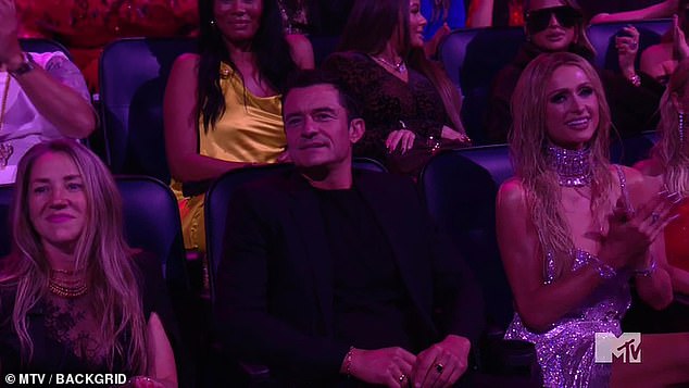 Fans couldn't help but notice Orlando Bloom making some confused faces during Katy Perry's performance at the 2024 MTV VMAs; he had a tense expression on his face as he watched her sing I'm His, He's Mine.