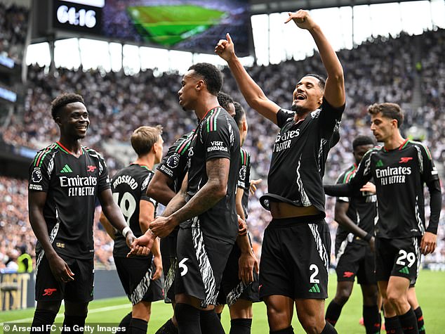 Arsenal players celebrate after beating Tottenham Hotspur in the Premier League on Sunday