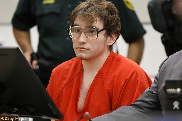 Pictured: Marjory Stoneman Douglas High School shooter Nikolas Cruz in court. Investigators say they found evidence he was 'obsessed' with the 2018 massacre that left 17 people dead