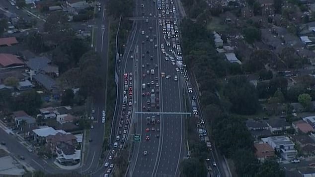 All lanes of the Merrylands motorway westbound and eastbound are closed between Burnett Street and the Cumberland Highway (pictured shows traffic in built-up area)