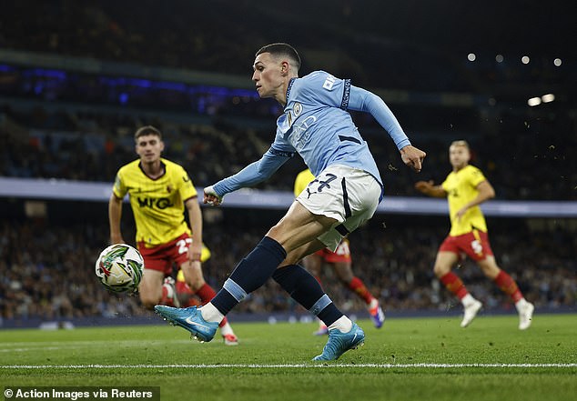 Phil Foden (centre) in action for Man City during Tuesday night's 2-1 win over Watford