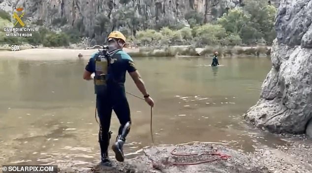 The trousers of missing British walker Alexander Johnson, who is feared to have been swept away by a devastating flood, were found yesterday by search teams in Mallorca (pictured)