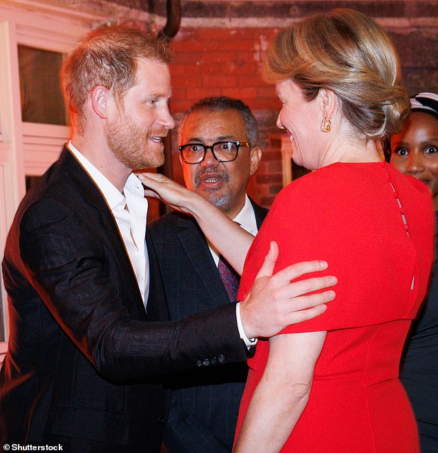 Prince Harry was photographed embracing Queen Mathilde of Belgium at an event in New York on Sunday