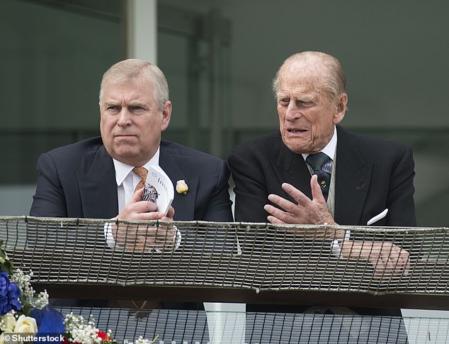 Prince Andrew and his father Prince Philip watch the horse races at Epsom Downs, Surrey, in 2016