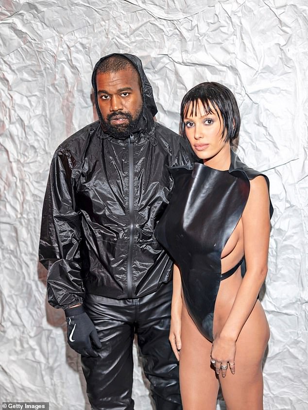 CCTV footage of Bianca Censori, 29, (right) has revealed she wears a completely different outfit to her usual scantily clad ensembles when her husband Kanye West, 47, (left) is not around