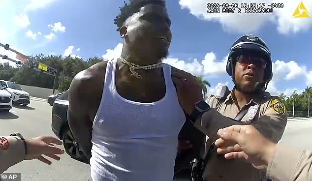 Hill was at the center of a dramatic traffic stop on his way to Miami's opening game on Sunday