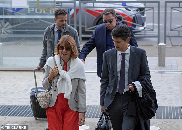 Gisele Pelicot arrives with her lawyer at the trial of her ex-husband and 50 other men accused of raping her