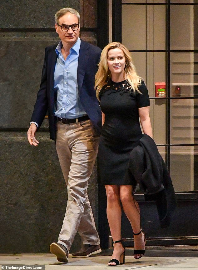 Reese Witherspoon showed off her new romance with Oliver Haarmann as the pair held hands during a date night in NYC on Wednesday