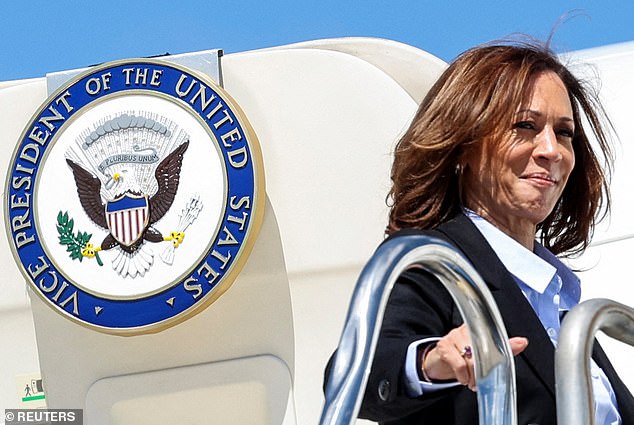 Democratic presidential candidate and US Vice President Kamala Harris boards Air Force 2