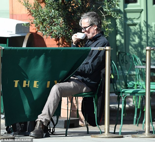 The former pop star enjoyed a cup of coffee al fresco at the luxury restaurant The Ivy