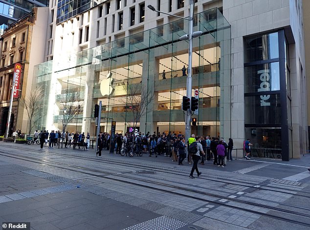 An image of Apple customers waiting outside the brand's flagship store in Sydney for the launch of the new range of iPhones has caused a stir online (pictured)