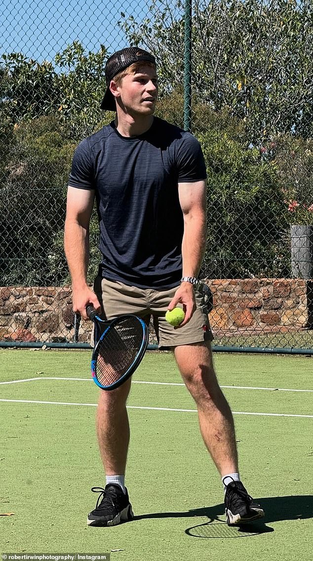 Robert Irwin, 20, (pictured) set pulses racing on Monday as he showed off his muscular biceps during a casual game of tennis