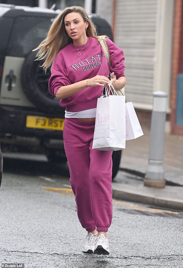 Ryan Gigg's pregnant girlfriend Zara Charles looked every inch the doting mum as she was spotted stocking up on baby supplies during her outing in Hale on Thursday