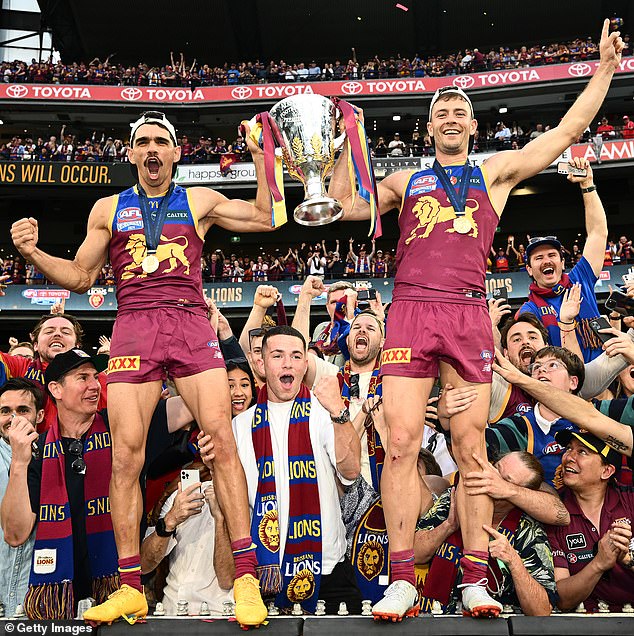 The Swans had no answer to Brisbane's attacking brilliance (pictured left, Charlie Cameron and Josh Dunkley with the Premiership Cup)