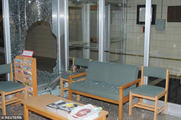 Broken pieces of tempered glass cover chairs and stools at Sandy Hook Elementary School after the December 2012 shooting