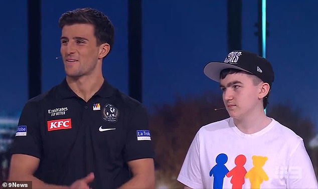 Cancer-stricken Riley McGuane stole the show at Melbourne's My Room Grand Final Spectacular event on Thursday after his epic one-liner as Eddie McGuire's host (the youngster is pictured right, with Collingwood star Nick Daicos)