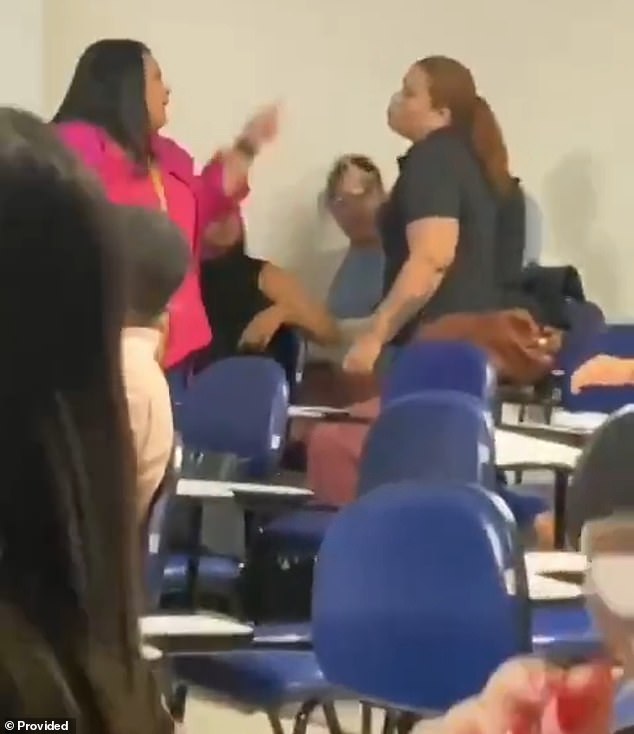 A female student (left) argues before a brawl with a classmate (right), who is also a police officer and who pointed a gun at her in a crowded classroom at Estácio College in Maceió, Brazil, last Friday.