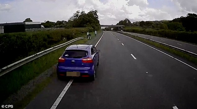 Further ahead, a stationary car can be seen that Catterall doesn't notice. His truck then slams into the side of the car, nearly hitting people standing on the side of the road.