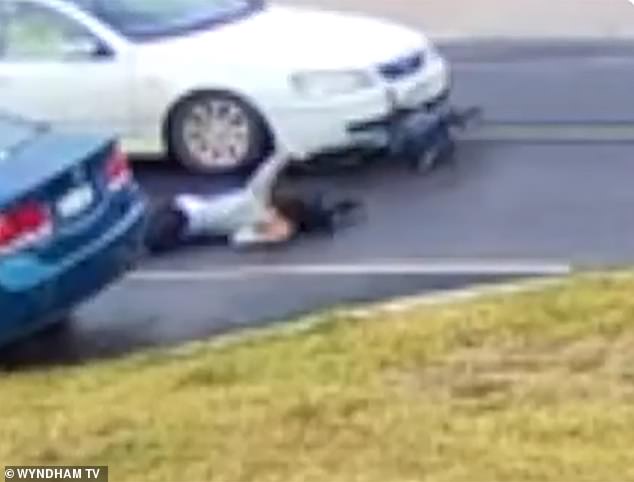 CCTV shows the moment the girl is thrown from a sedan's bumper onto a suburban street